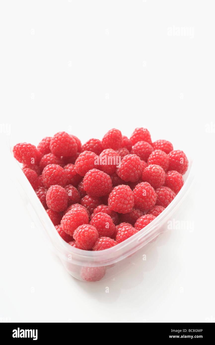 Raspberries in plastic container Stock Photo - Alamy