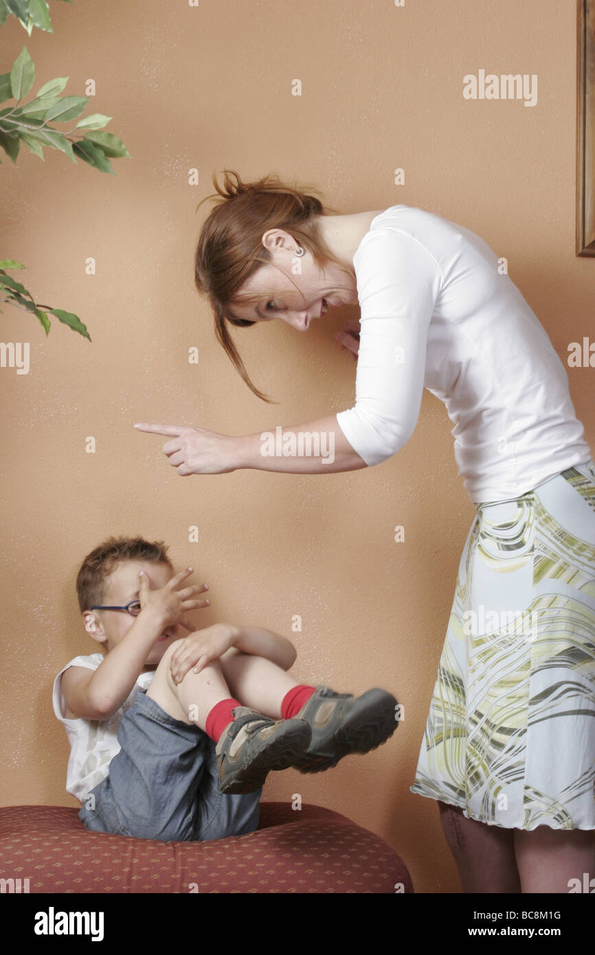 Violent mother disciplining frightened son at home:Child abuse - SerieCVS417224 Stock Photo