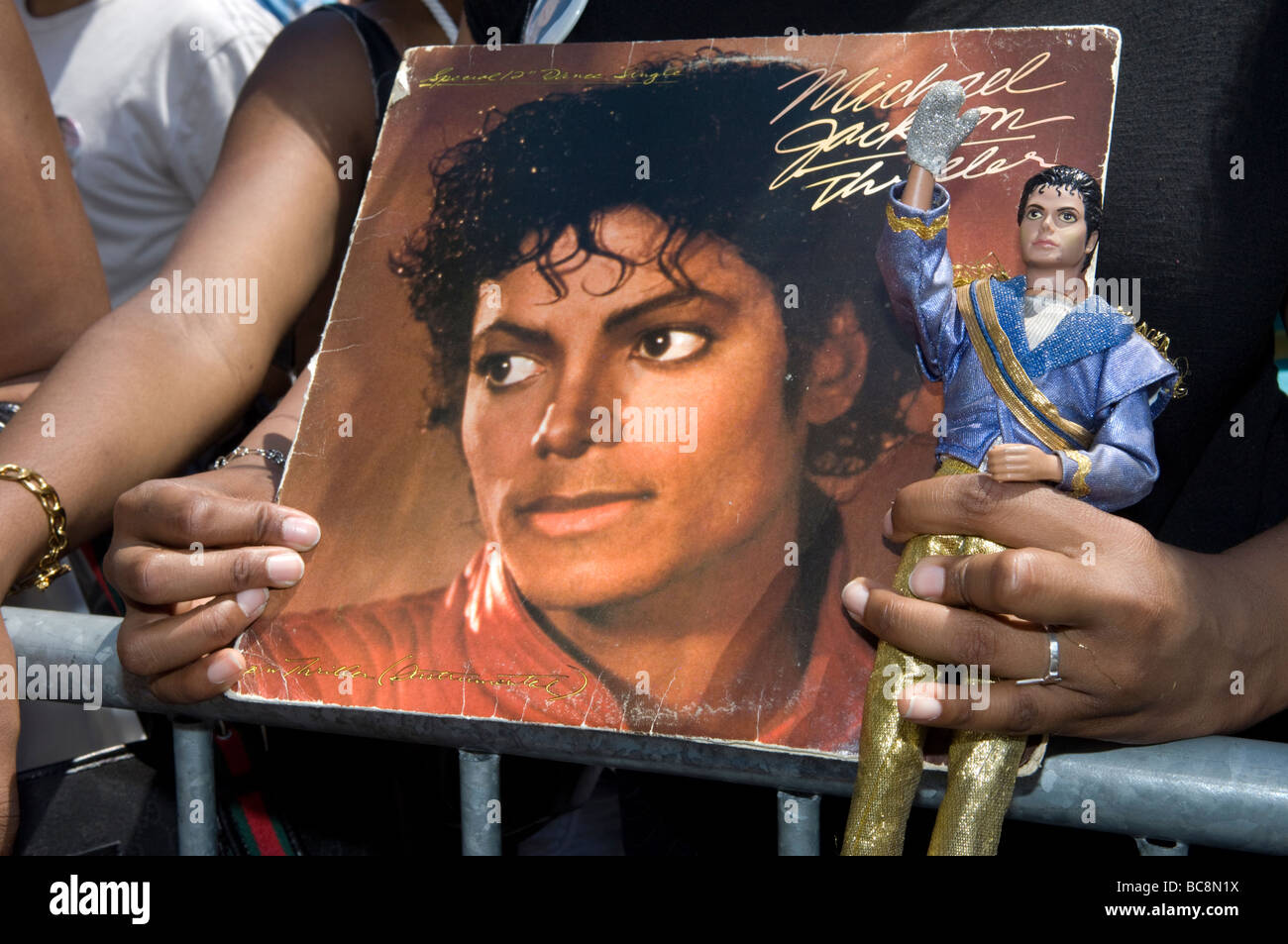 Thousands of Michael Jackson fans gather outside the Apollo Theater in