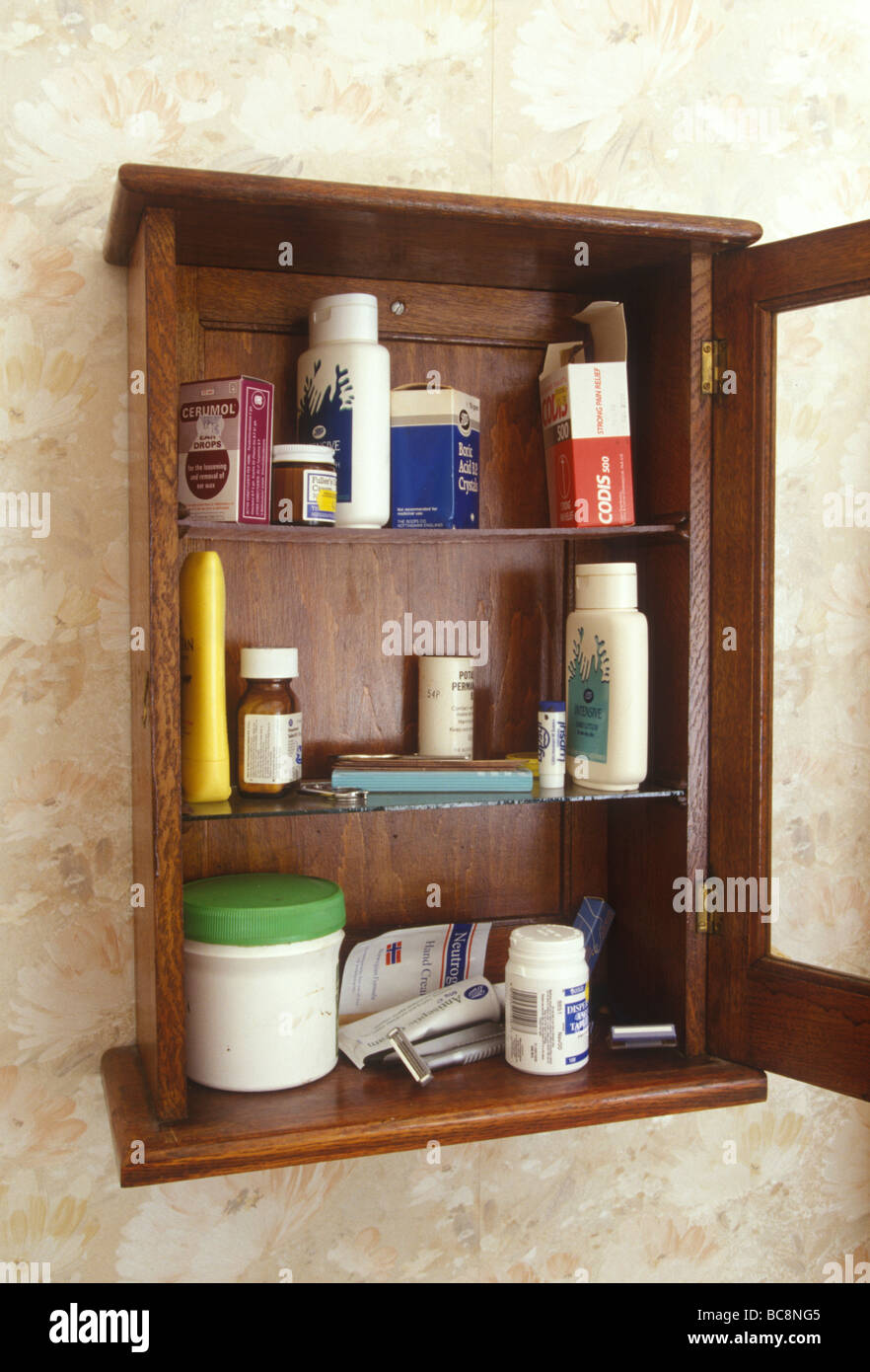 still life of a medicine cabinet with a selection of old pots of cream and bottles of pills Stock Photo