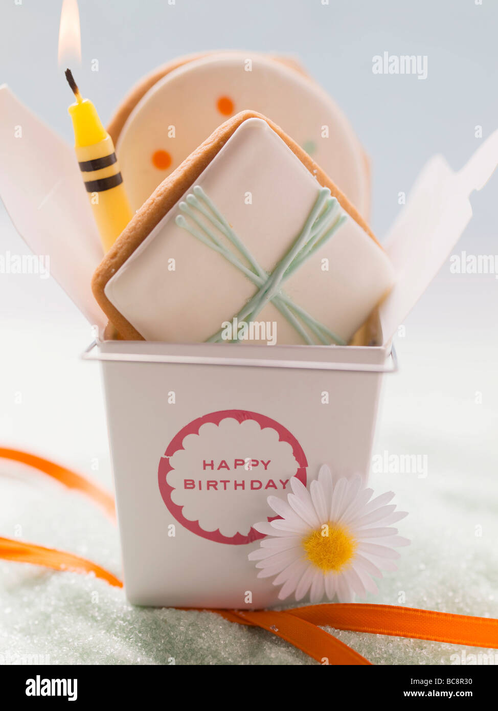 Biscuits and candle for a birthday Stock Photo Alamy