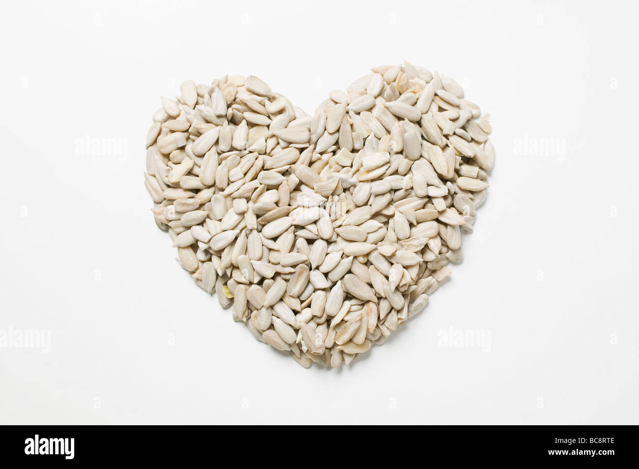 Sunflower seeds forming a heart Stock Photo Alamy