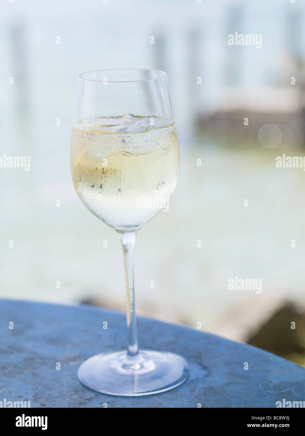 Glasses Of White Wine On Table by Foodcollection Rf