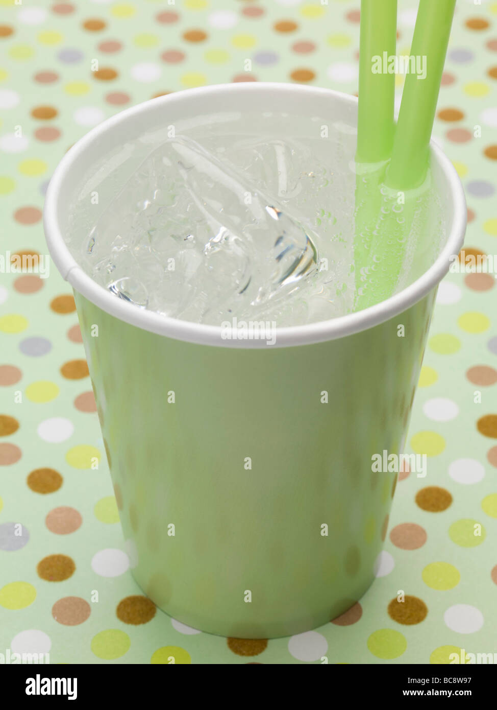 Mineral water with ice cubes in green paper cup Stock Photo - Alamy