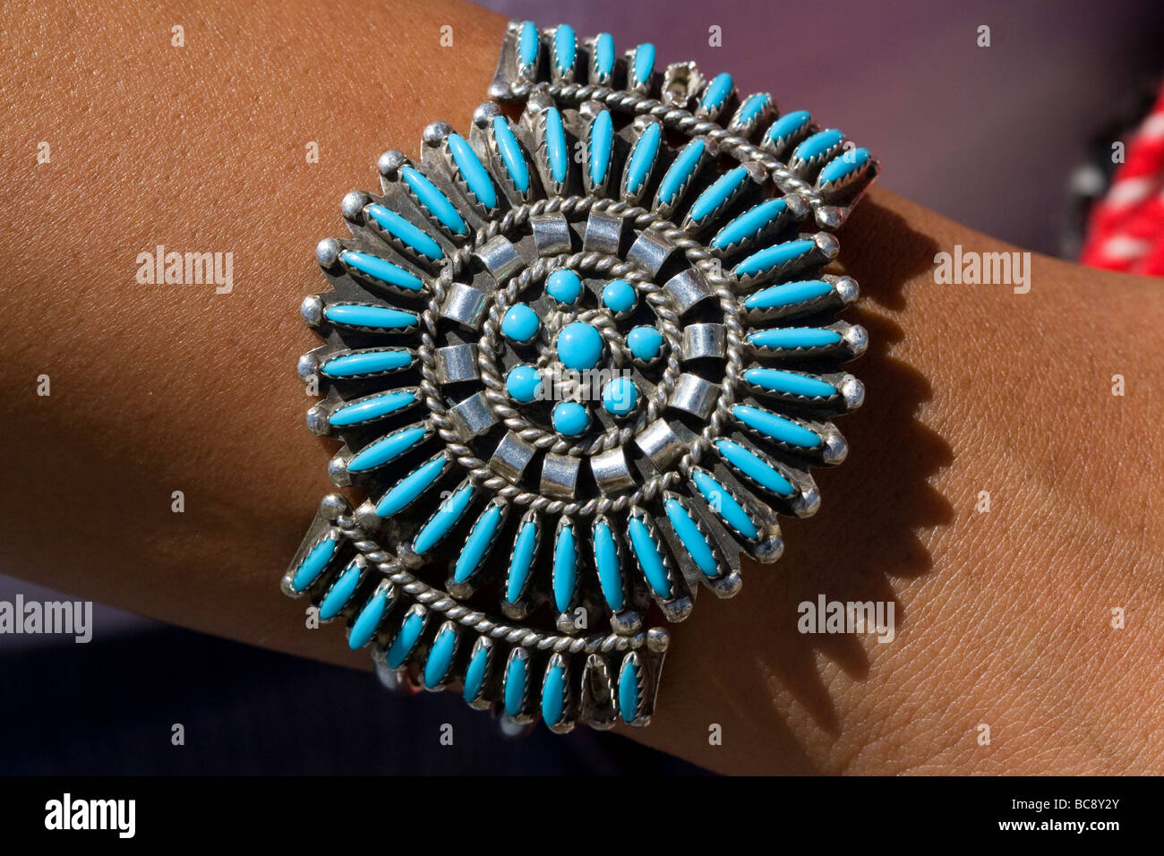 Turquoise bracelet crafted and worn by a Navajo Indian woman from Arizona USA Stock Photo