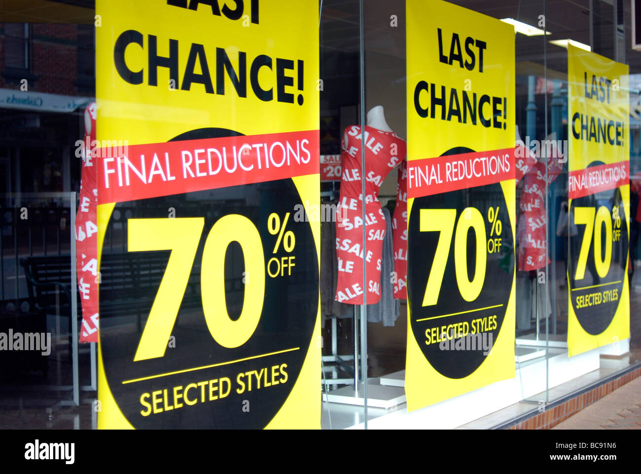 Final reductions closing down Sale sign in shop window Stock Photo