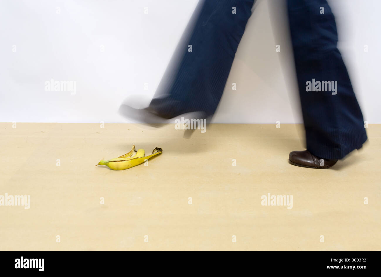 woman going to step on a bananapeel Stock Photo