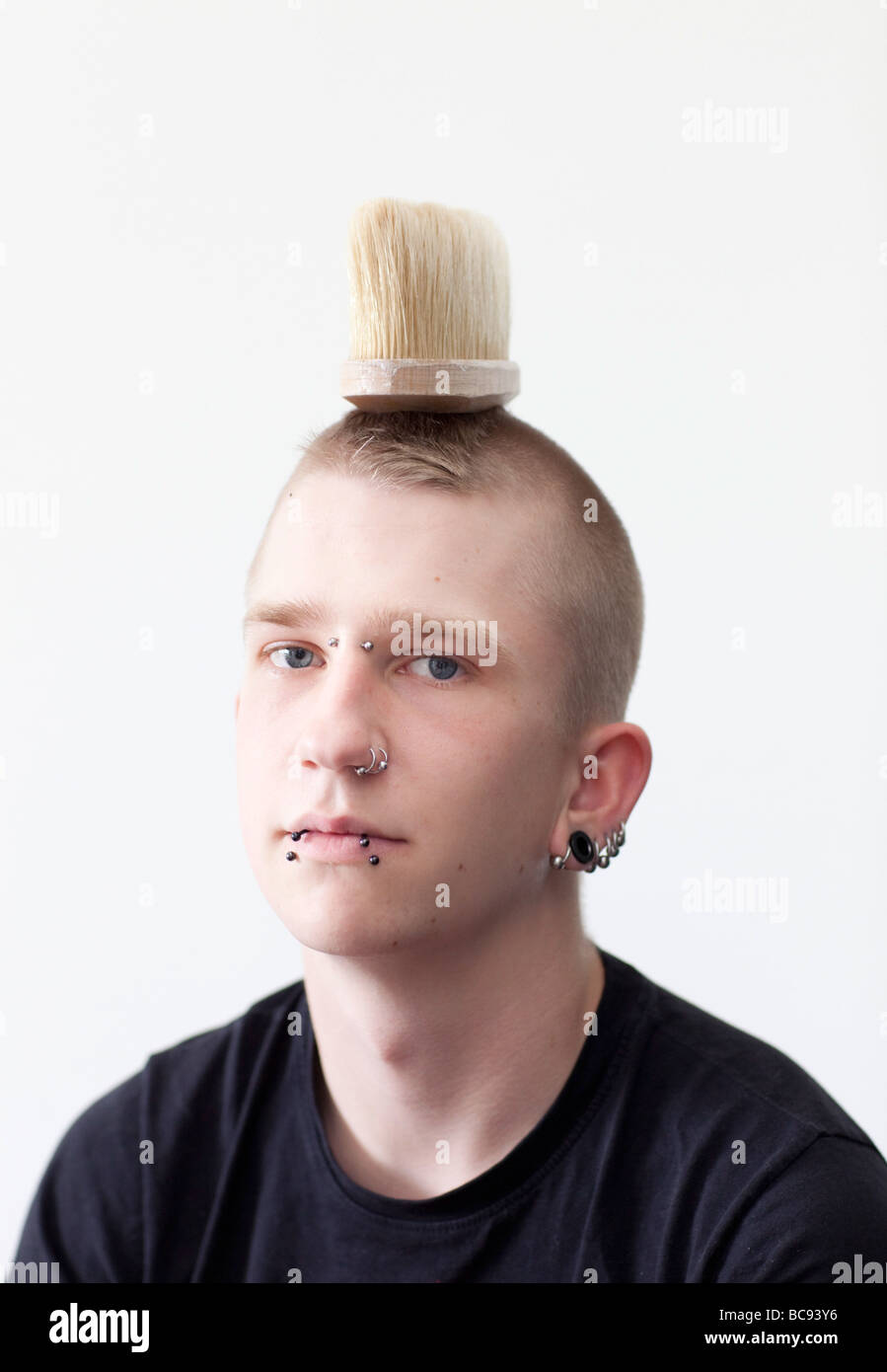 Punker with a brush on his head Stock Photo