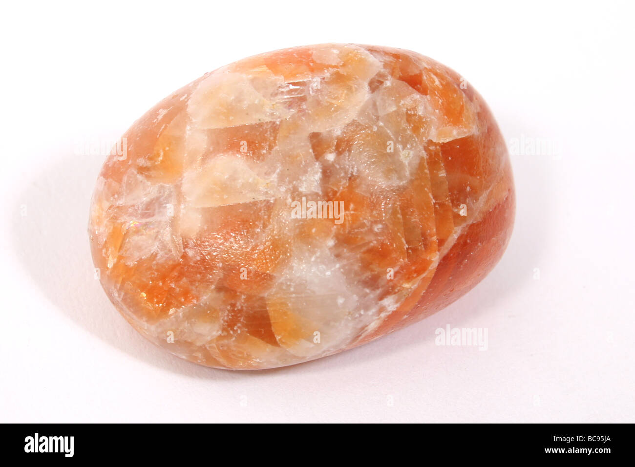 An orange calcite stone. Stock Photo