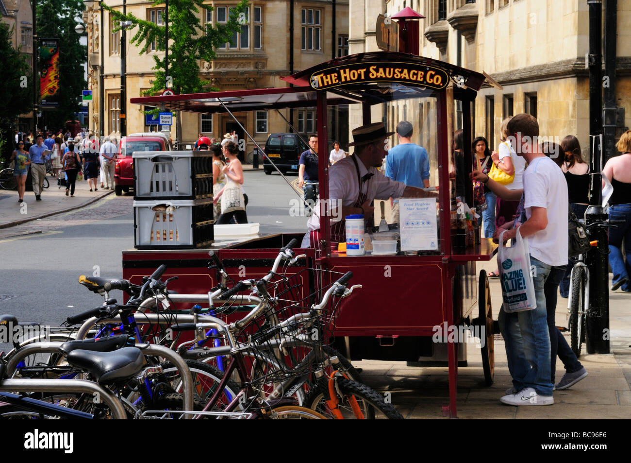 The Hot Sausage Hot Dog vendor in Sidney Street Cambridge England Uk Stock Photo