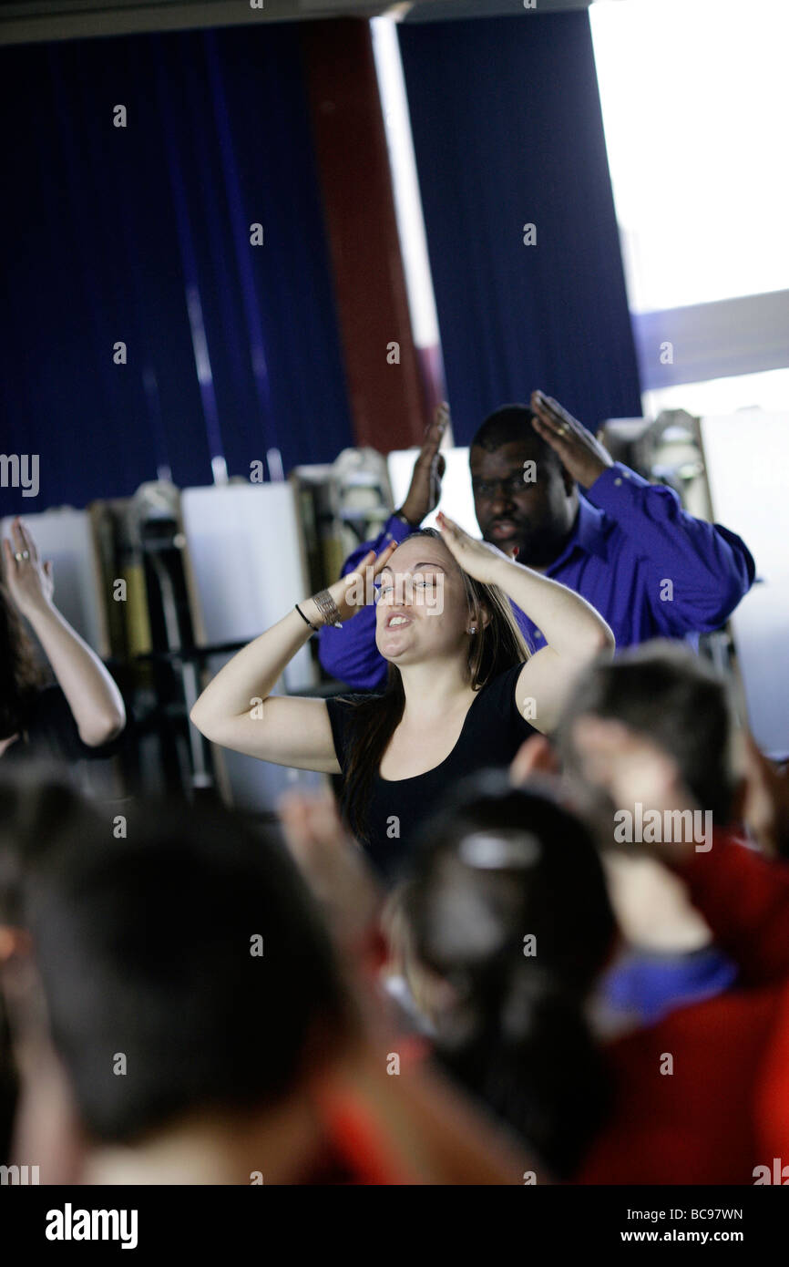Music teacher playing musical games with a class Stock Photo