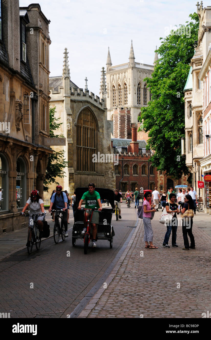 A pedicab and tourists in Trinity Street, Cambridge England UK Stock Photo