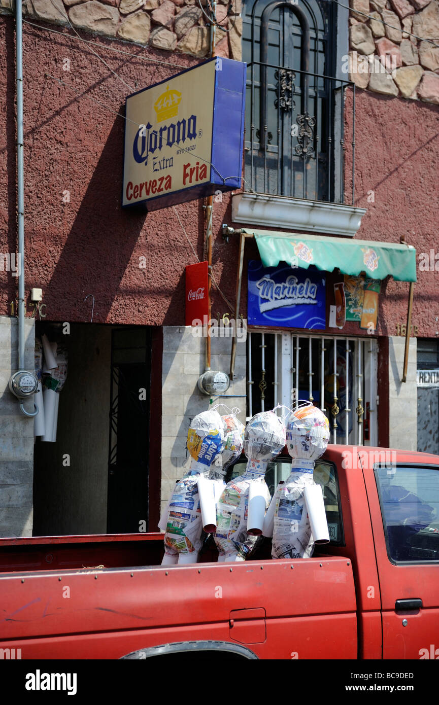 THree inflatable bodies outside a Tlaquepaque bar Stock Photo