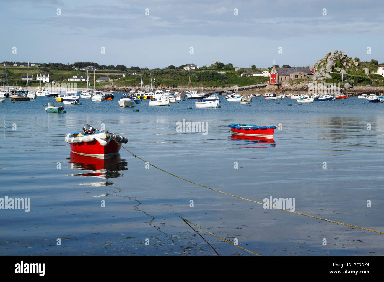 Two red boats in St. Mary's harbour, Isles of Scilly, Cornwall UK. Stock Photo