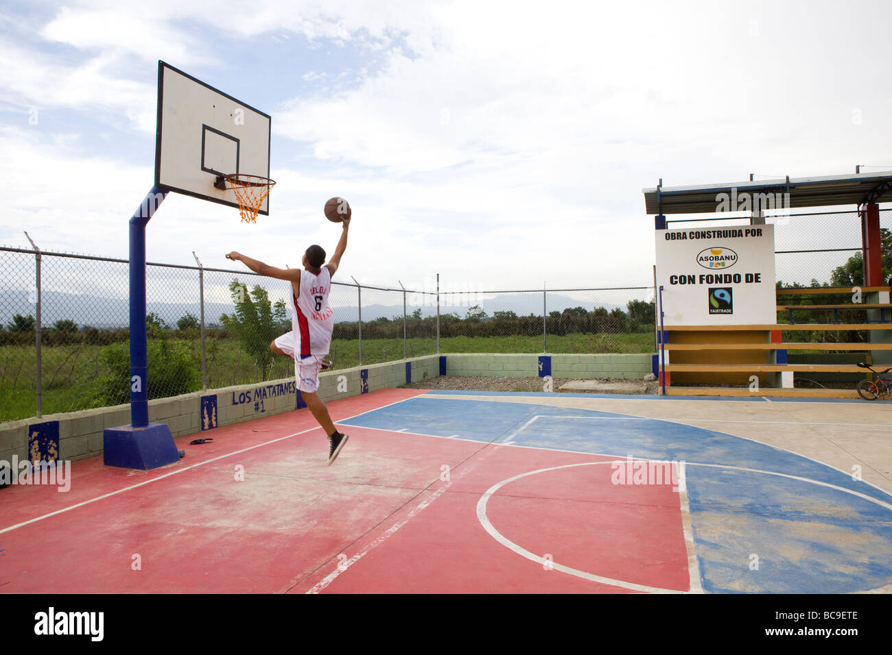 Young man playing basketball in Dominican Republic. Funds from Fairtrade  paid for the court Stock Photo - Alamy