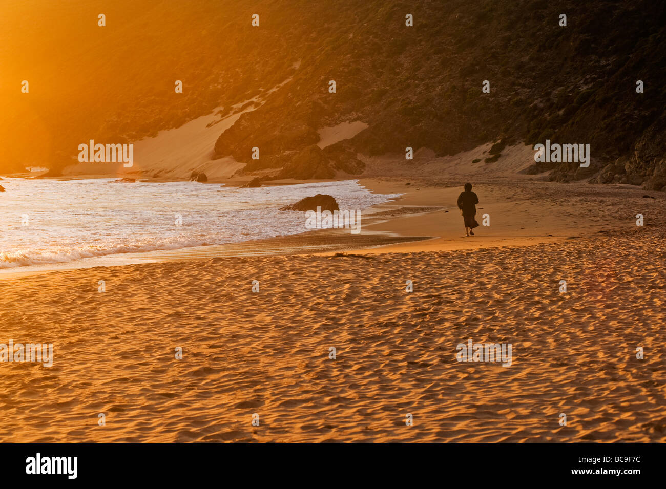 Woman walking on rocky shore hi-res stock photography and images - Alamy