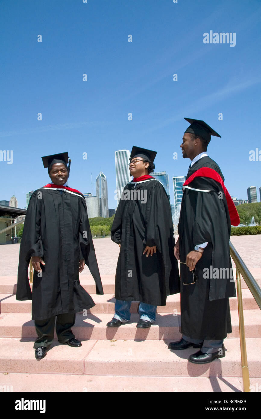 Multi ethnic college graduates celebrate the occasion in Grant Park Chicago Illinois USA  Stock Photo