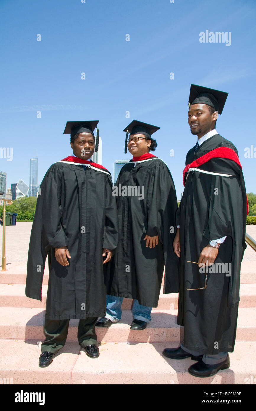 Multi ethnic college graduates celebrate the occasion in Grant Park Chicago Illinois USA  Stock Photo