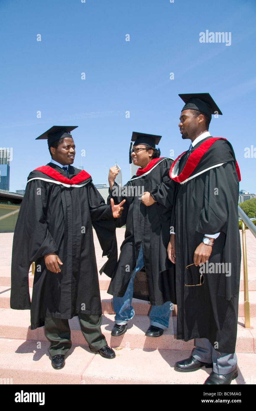 Multi ethnic college graduates celebrate the occasion in Grant Park Chicago Illinois USA  Stock Photo