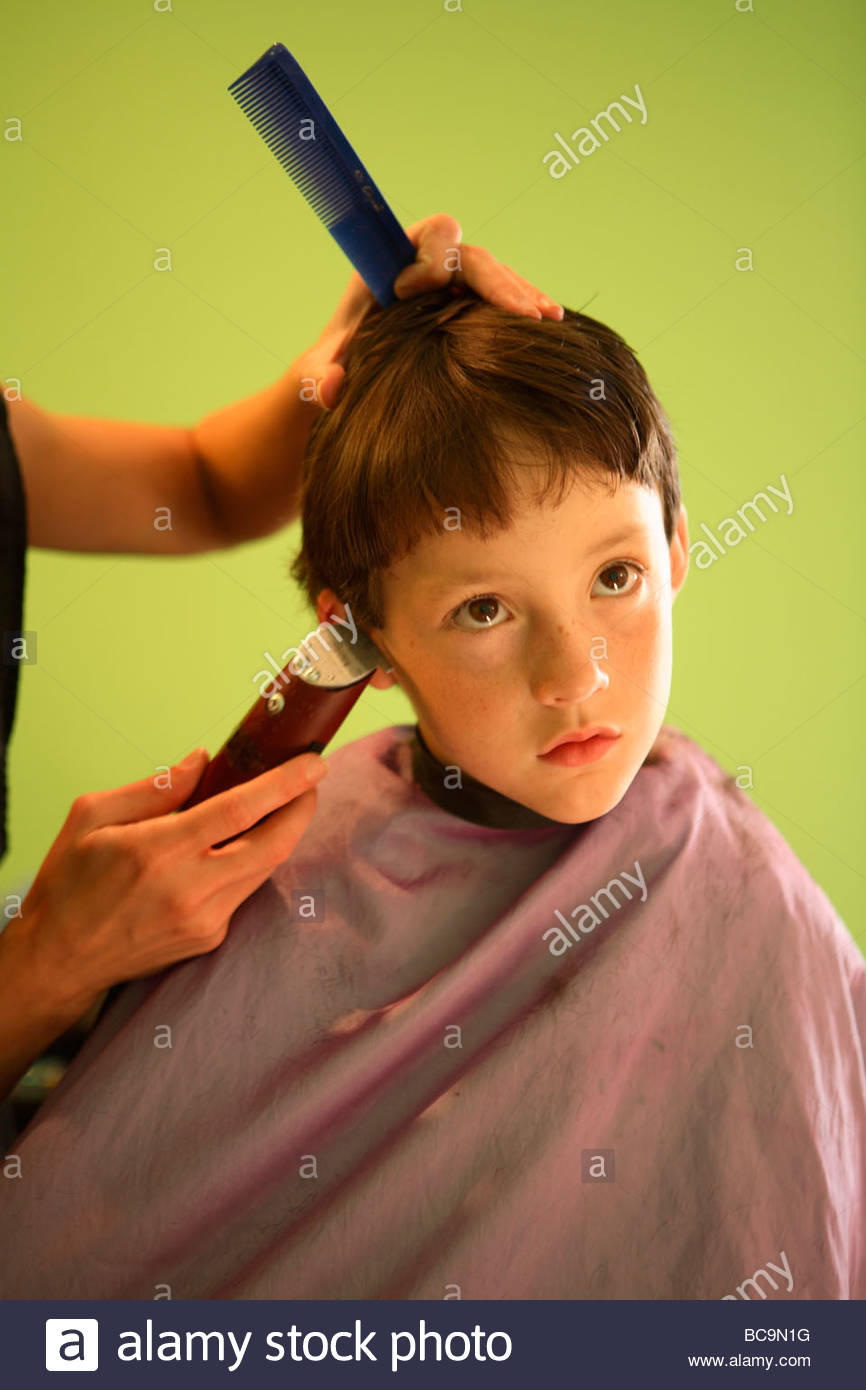 A 7 Year Old Boy Gets A Haircut Stock Photo 24800316 Alamy