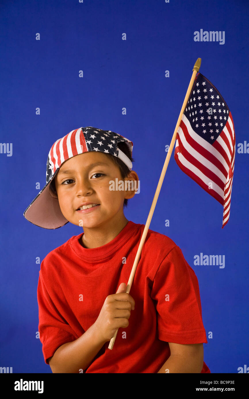 Portrait of boy July 4th parade waving holding American flag and smiling MR  © Myrleen Pearson Stock Photo