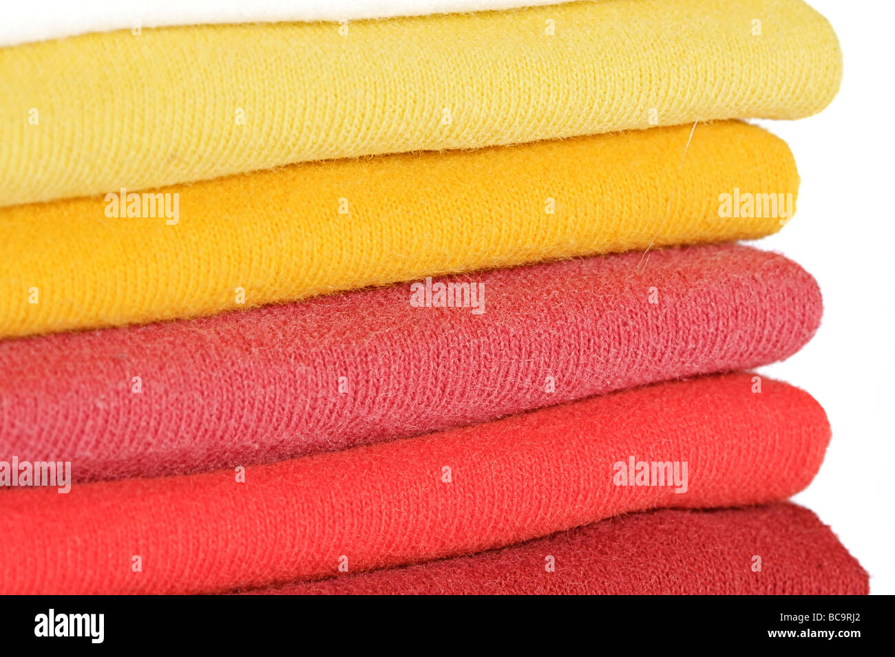 Multi Colored Tee Shirts stacked in a neat pile Stock Photo - Alamy