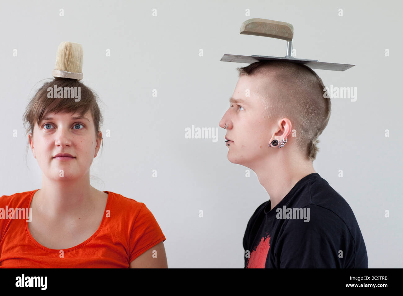 Trainees waering brush and bricklayer s trowel on the head Stock Photo