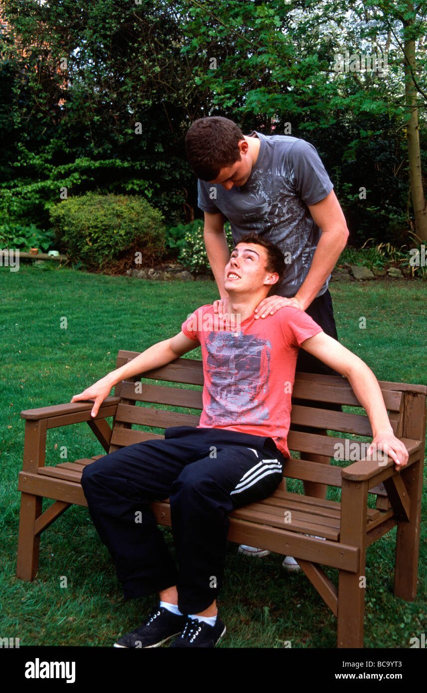 Non-identical twin brothers happy after university exams finish Kent England Stock Photo