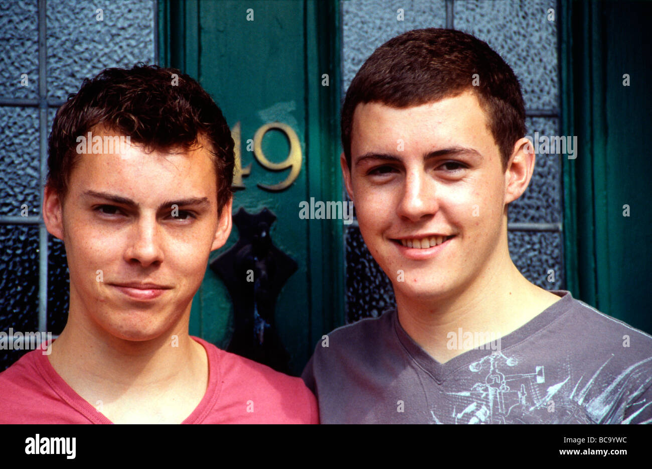 Non-identical twin brothers at home, Kent, England, after student exams are over Stock Photo
