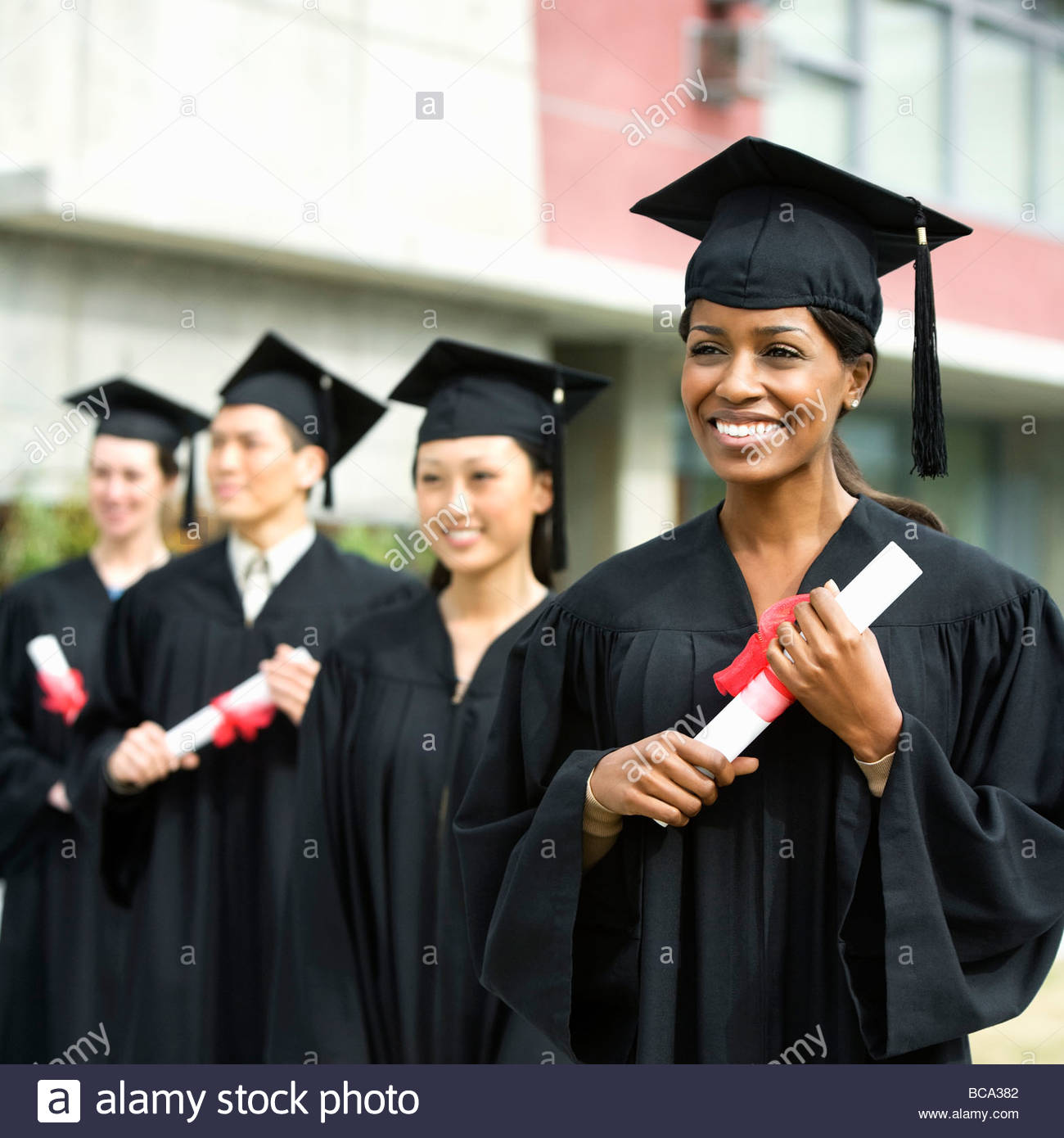 Graduation Cap And Gowns Stock Photos & Graduation Cap And Gowns Stock
