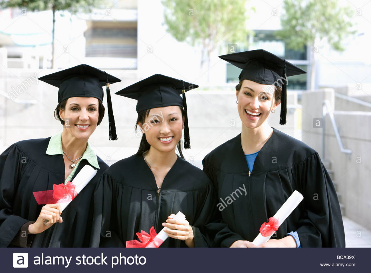 Graduation Cap And Gowns Stock Photos & Graduation Cap And Gowns Stock