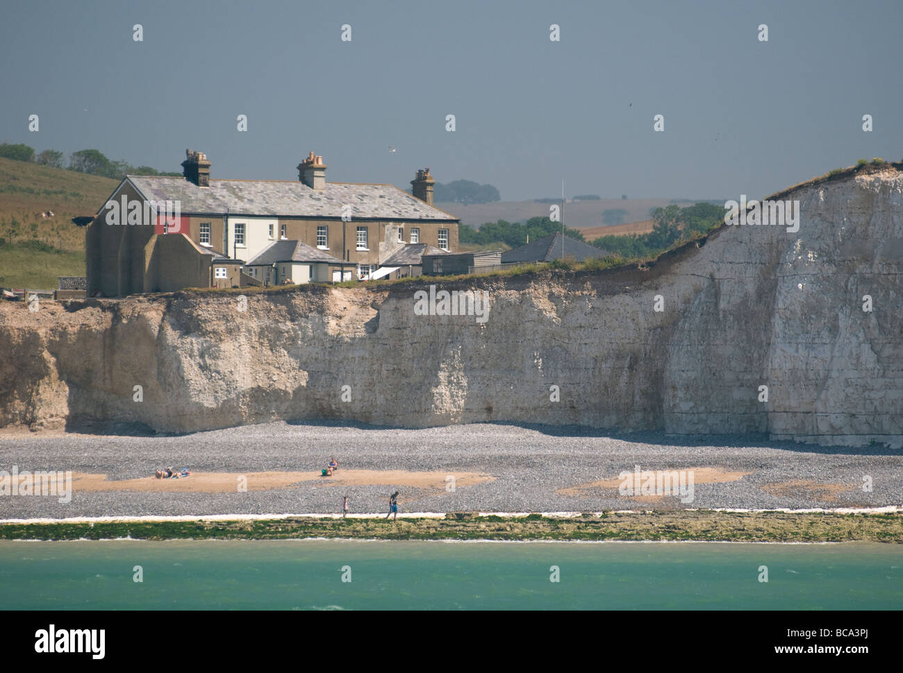 Old fisherman's houses on the cliff edge at Birling Gap, East Sussex, England. Stock Photo