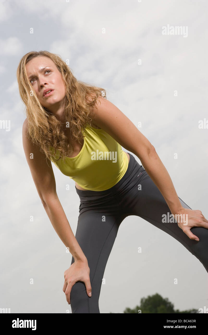 Young woman bending over resting hires stock photography and images