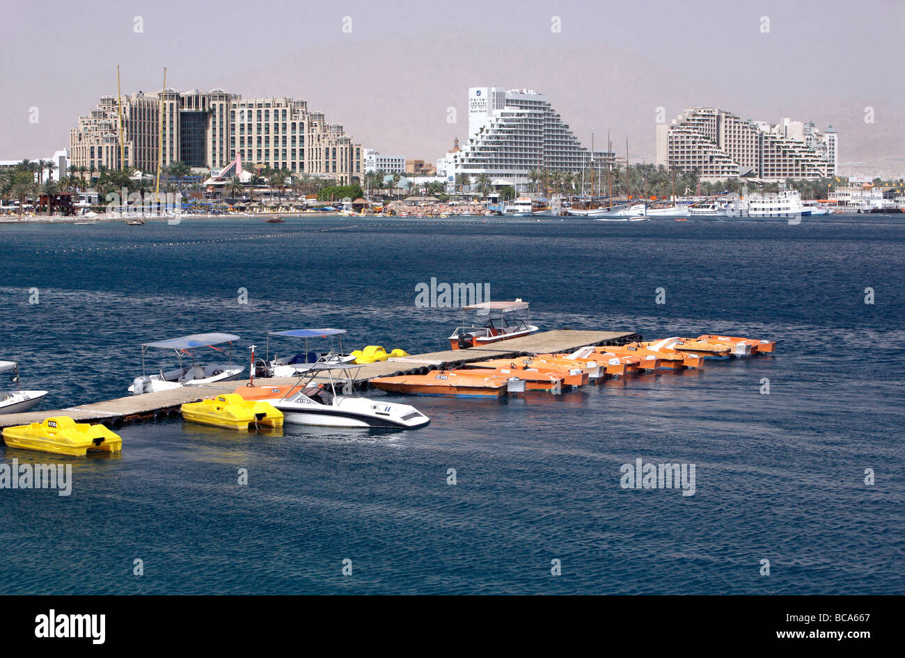 Red sea with jetty and boats, Eilat, Israel Stock Photo