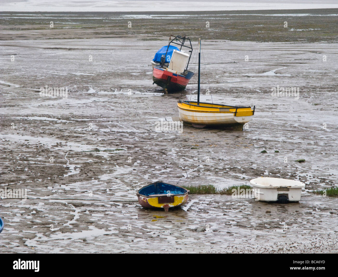 yachts and boats moored at low tide near Wallasey Stock Photo
