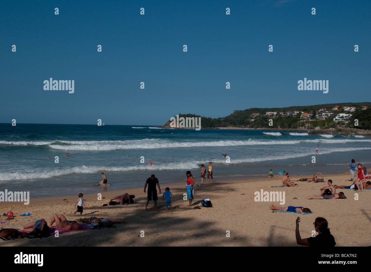 People sunbathing on Manly beach, South Steyne, Sydney, NSW, Australia Stock Photo
