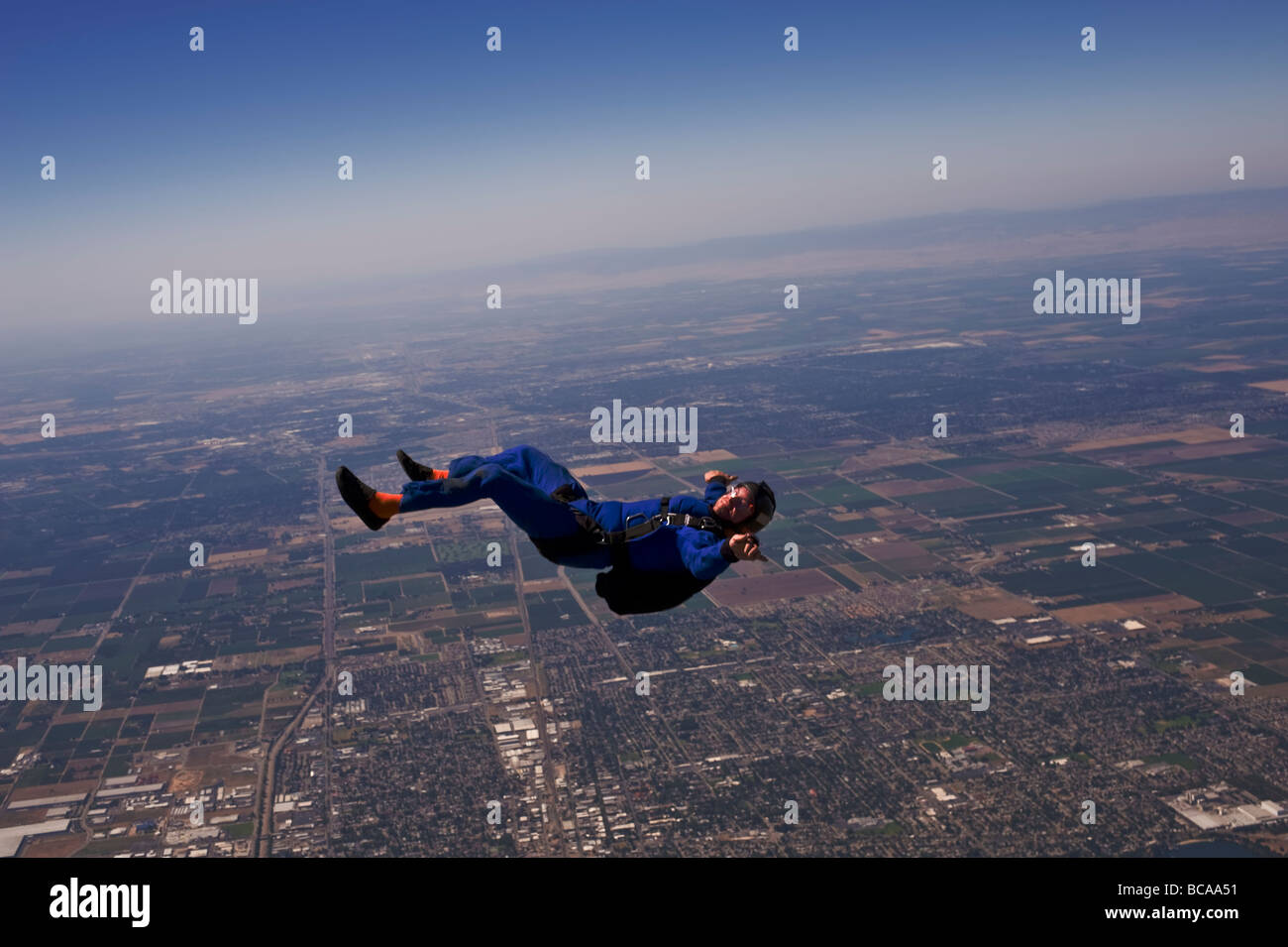 skydiver flying on back Stock Photo