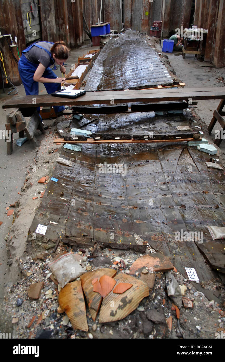 Archaeologist working on excavation of ancient shipwreck found during subway construction, Istanbul Turkey Stock Photo