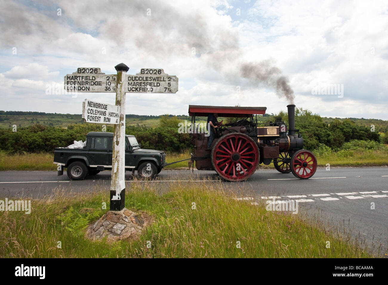 A steam locomotive towing a land rover Stock Photo - Alamy