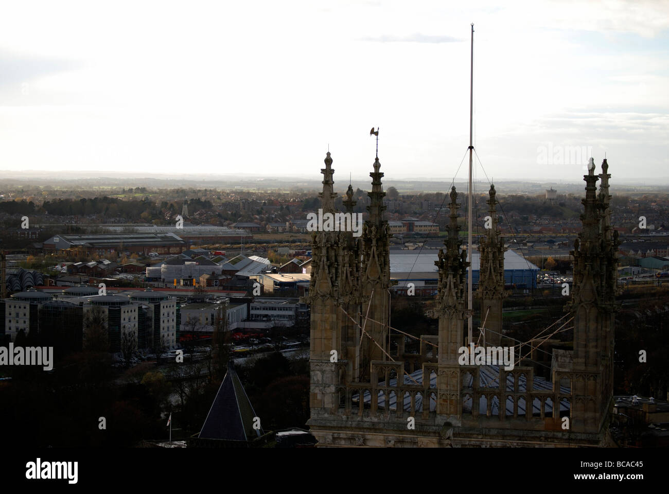 View from the central tower at York Minster looking over one of the cathedrals smaller western towers to the city below Stock Photo