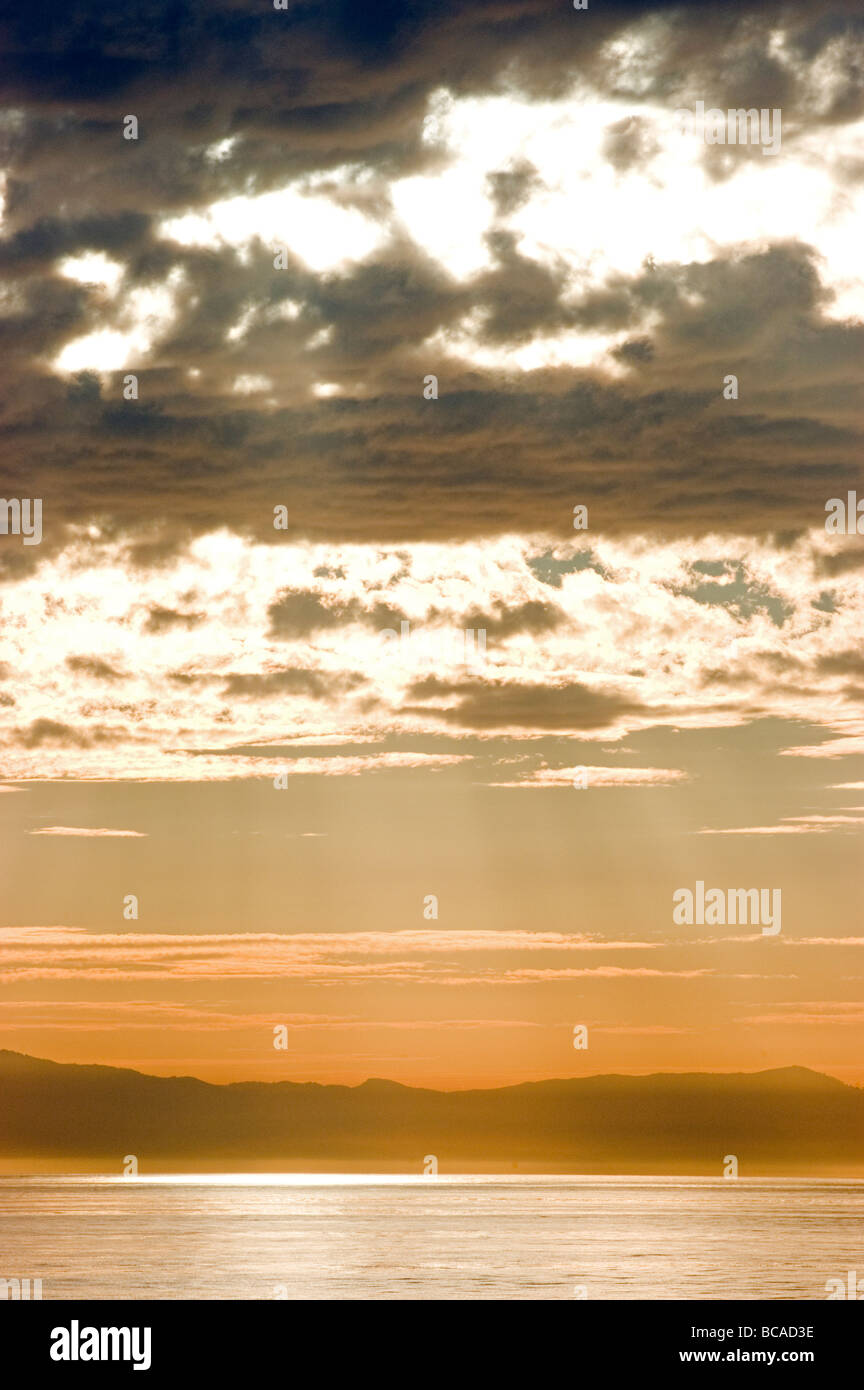 Sun rays over clouds hi-res stock photography and images - Alamy