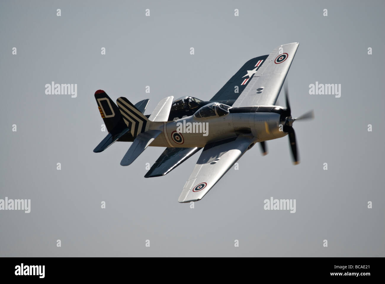 Two Grumman F8F Bearcats fly in formation at an air show. Stock Photo