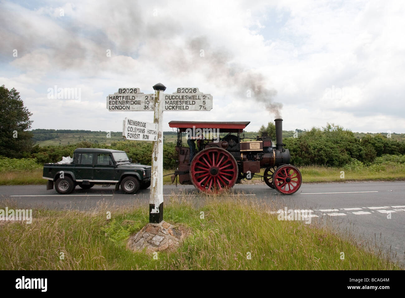 A steam locomotive towing a land rover Stock Photo - Alamy