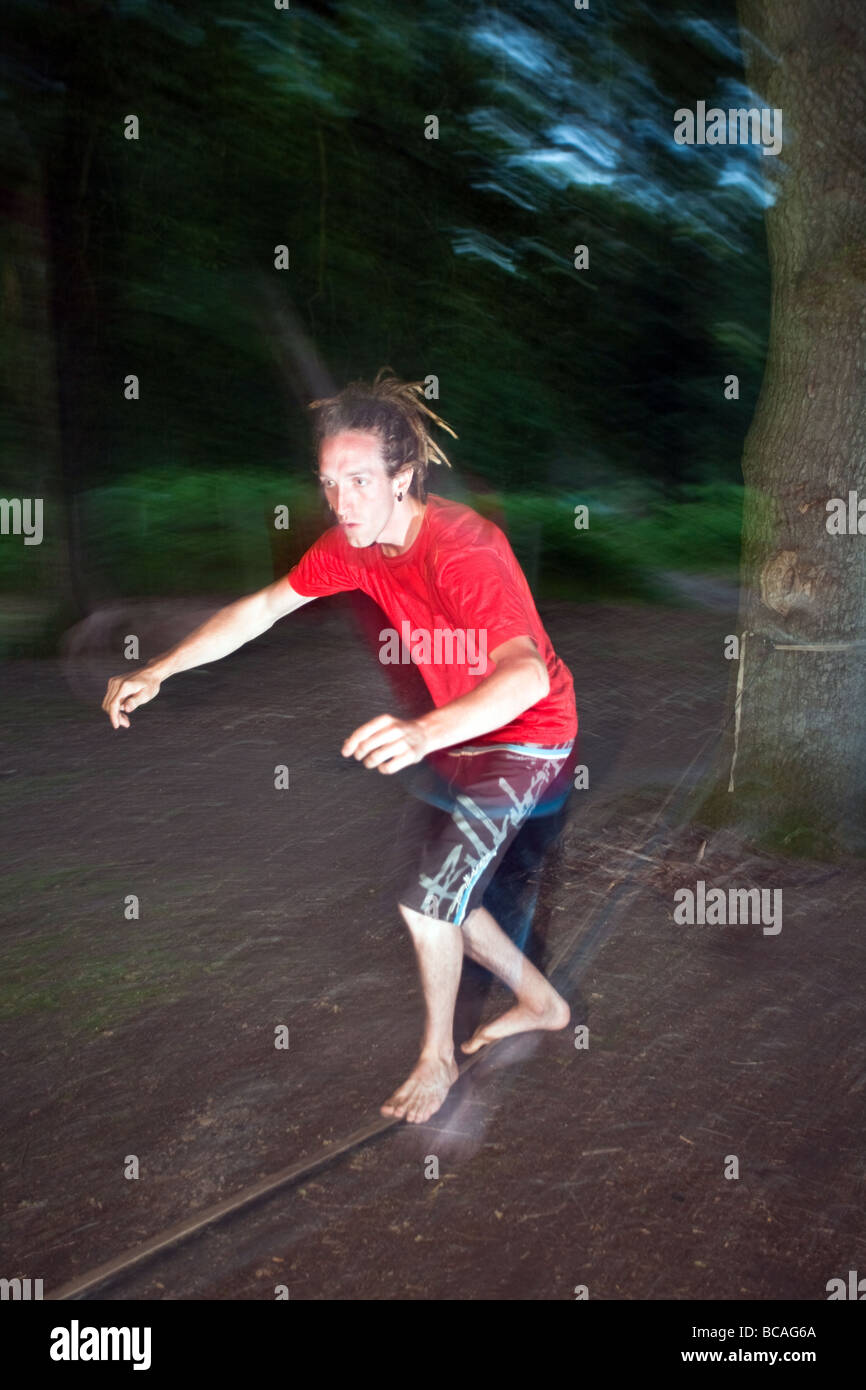 A man slack lines Stock Photo - Alamy