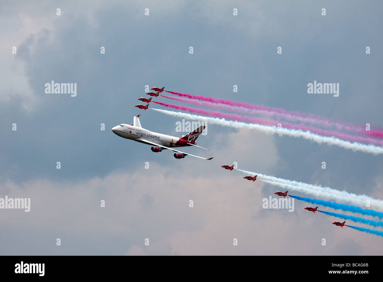Virgin Atlantic - Boeing 747-400 and Red Arrows aerial display at Biggin Hill Airshow Stock Photo
