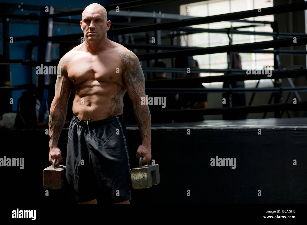 A mixed martial arts fighter demonstrates his strength Stock Photo Alamy