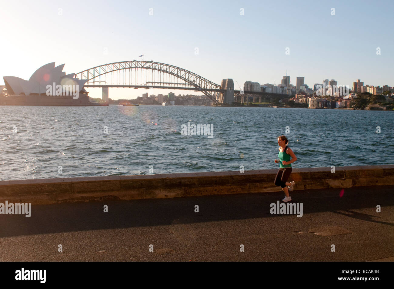 Jogger with Harbour Bridge in the background, Sydney, NSW, Australia Stock Photo