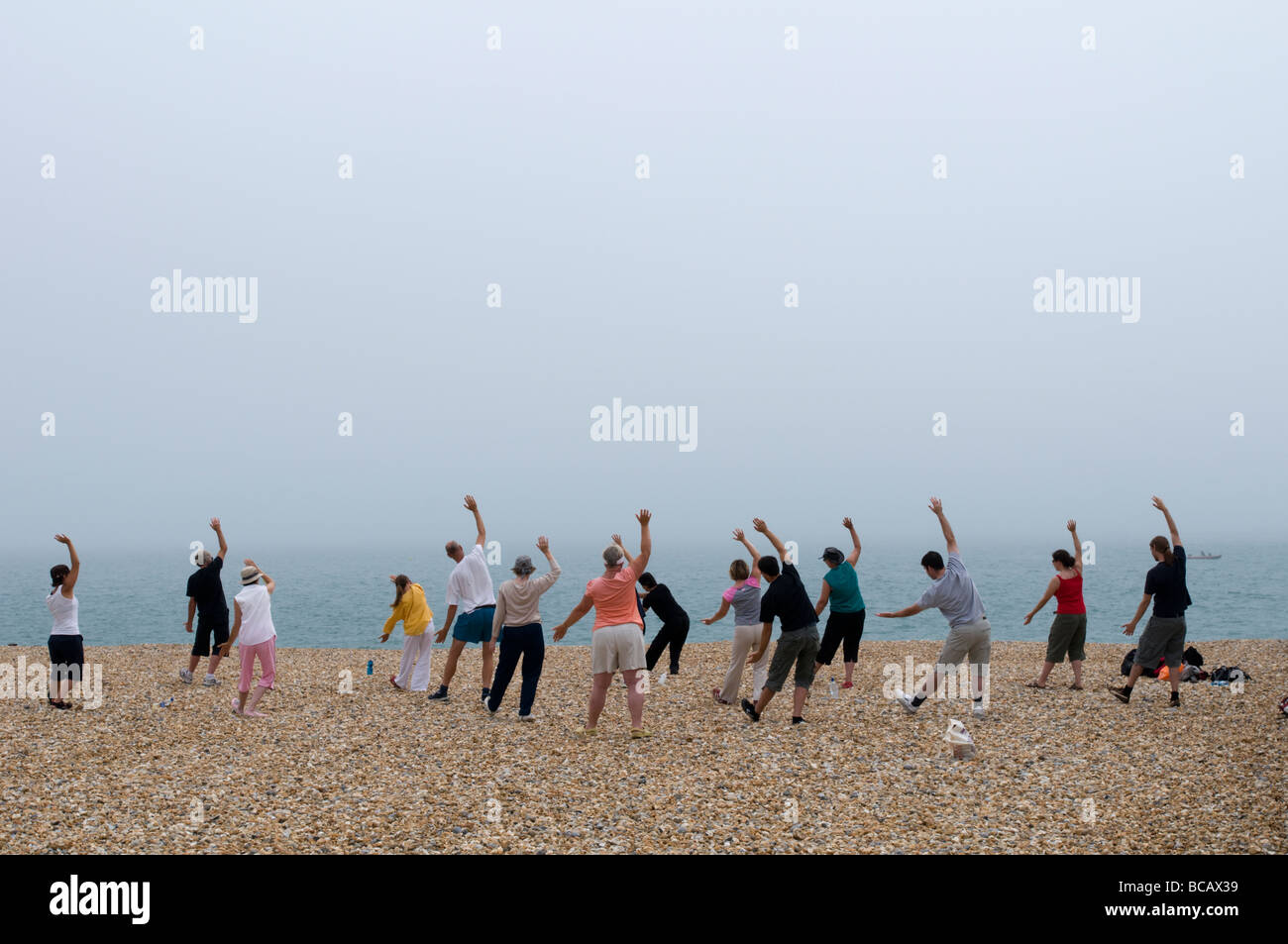 UNITED KINGDOM, ENGLAND, 4th July 2009. A class takes place on the beach in Eastbourne. Stock Photo