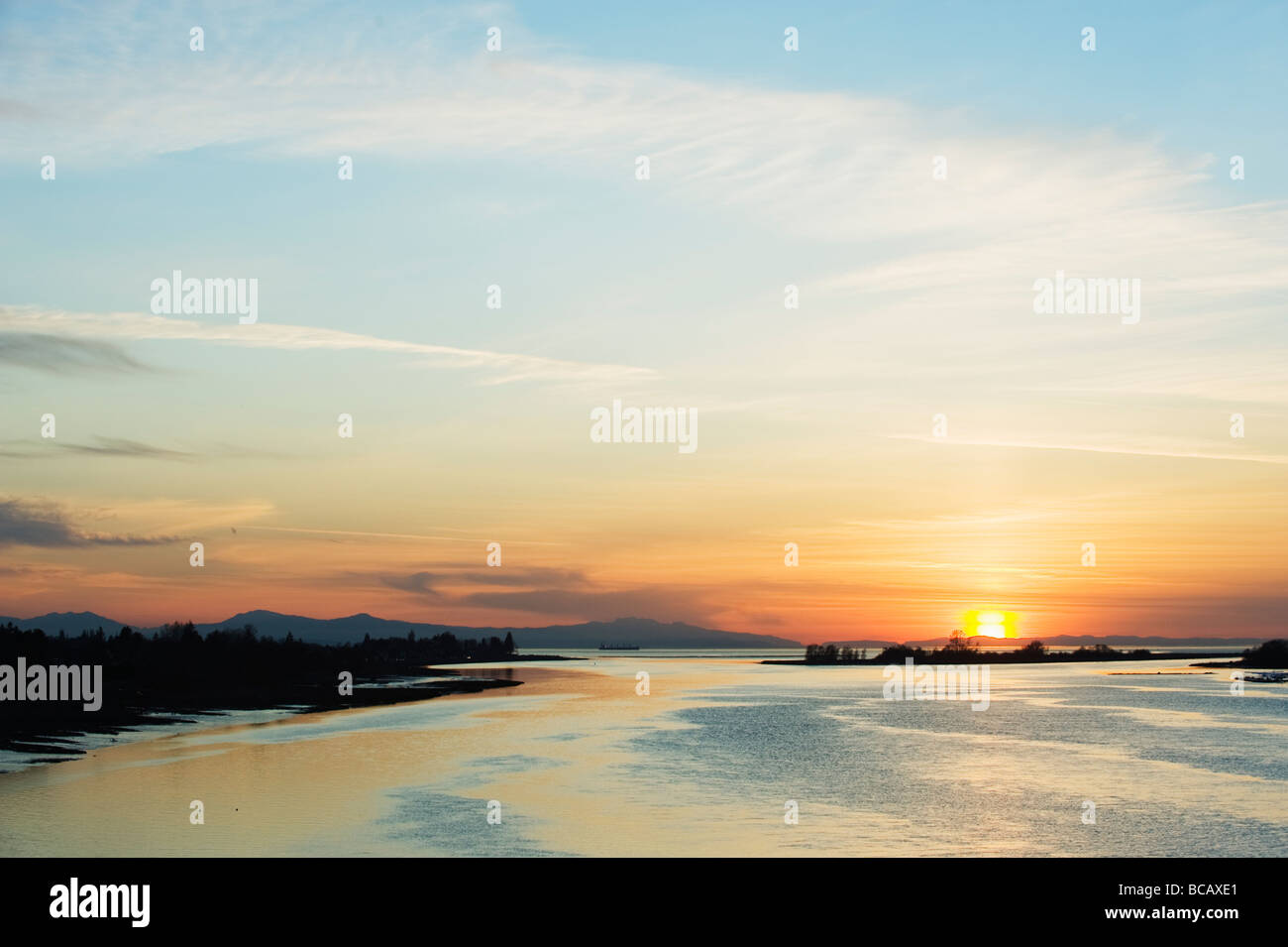 sunset over the Strait of Georgia at Middle Arm in Richmond Vancouver British Columbia Canada Stock Photo