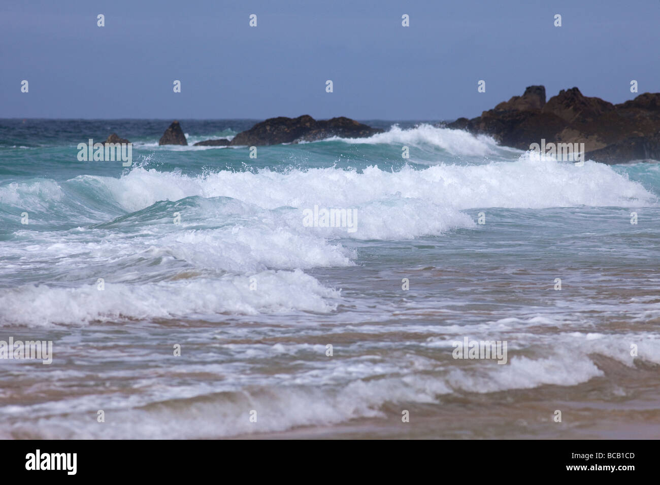 Surf waves Porthmeor beach summer sun June St Ives Cornwall